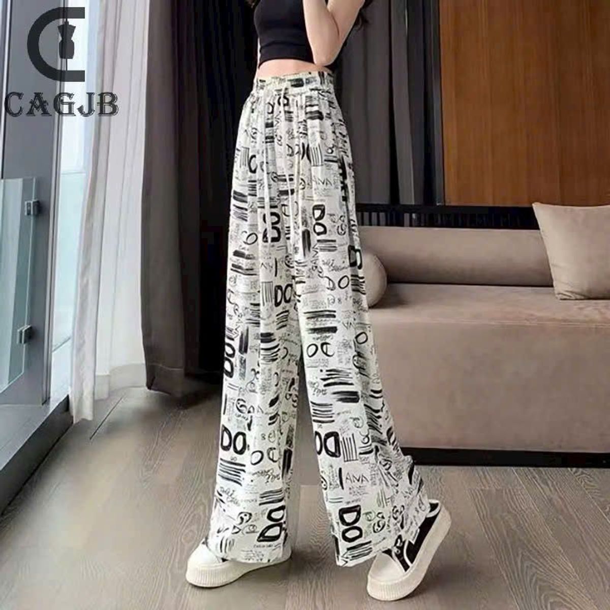 Quần suông lụa in hoạ tiết ống rộng cạp chun thời trang Quần suông lụa in hoạ tiết ống rộng cạp chun thời trang