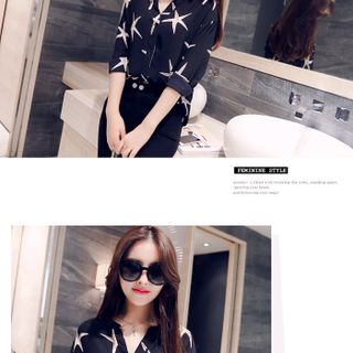 Áo sơ mi họa tiết sao biển nền đen sale 85000đ