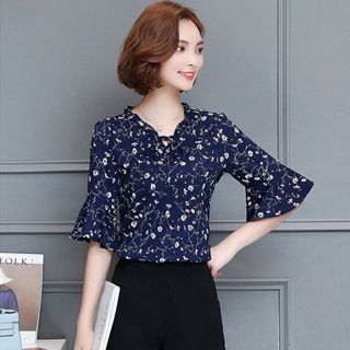 Áo sơ mi hoa kem cổ nhún cột nơ tay loe