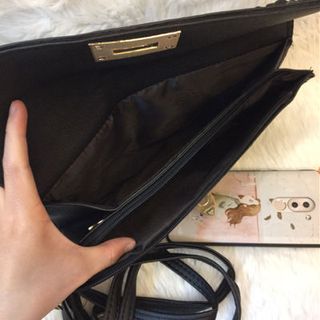 Ví cầm tay Clutch đinh valen thần thánh