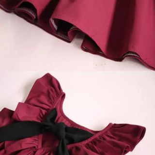 Váy sát nách bồng ngực nơ đen sau bé gái quảng châu
