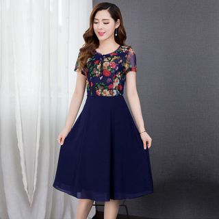 Đầm xòe chiffon xanh in hoa 3D phối ren cột nơ