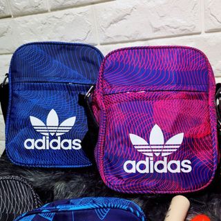 Túi xách đeo chéo thể thao mini size cao 21 Chất vải dù Bên trong có lót vải dù coa tên mẫu mã Có giảm giá Vui lòng inb