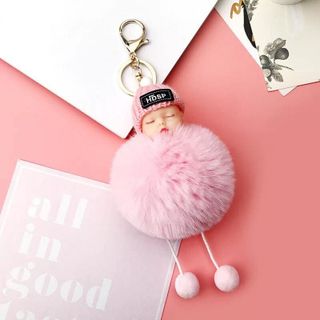 Móc khoá em bé đội nón