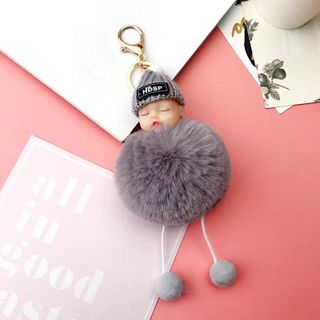 Móc khoá em bé đội nón