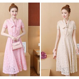 Đầm ren xòe hồng hở vai phối dây phụ kiện