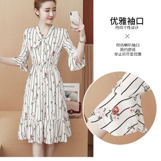 ĐẦM XÒE ĐUÔI CÁ TAY LOE CỘT NƠ IN SỌC HOA D1170