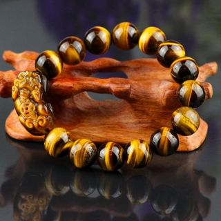 chuỗi đeo tay đá mắt hổ mặt tỳ hưu kích thước mỗi hạt 12mmgiá sỉ 99k 1 chuỗi z a l o 0 9 8 72 1 79 5 2