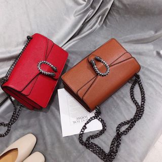 túi xách đầu rồng