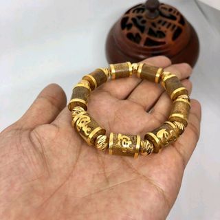 vòng trầm hàng tốc bọc vàng 18k