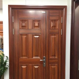 Cửa cổng chính chất liệu thép vân gỗ 184