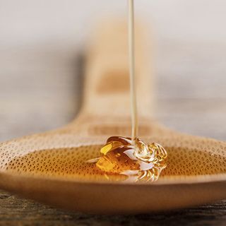 Mật ong chín hoa mộc GUMOC chai thủy tinh 500ml