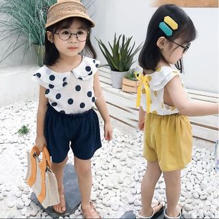 Chấm bi nơ sau bé gái