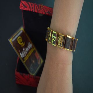 Vòng tay trầm hương sánh chìm bọc vàng non