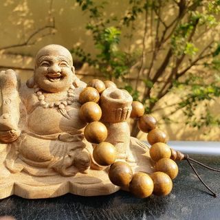 PHẬT DI LẶC ĐỂ XE OTO