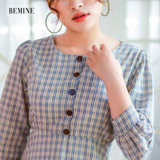Đầm sọc 2 lớp 5 nút trước