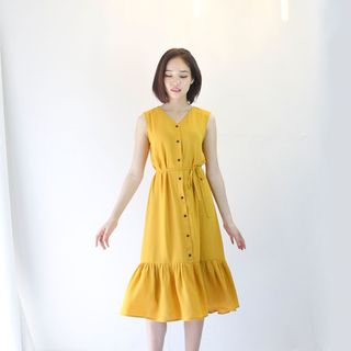 Đầm vàng nút nhún tùng-D004 giá sỉ