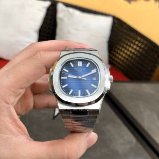Đồng hồ Patek Philipe vỏ trắng mặt xanh