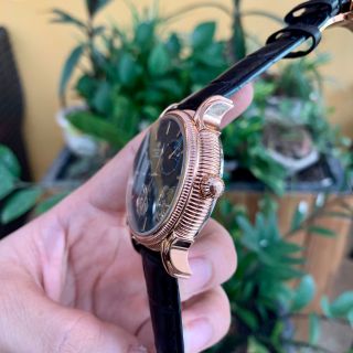 Đồng hồ nam Patek Philippe vỏ vàng mặt đen lộ cơ