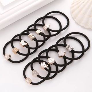 Dây cột tóc đen mặt nhựa vàng