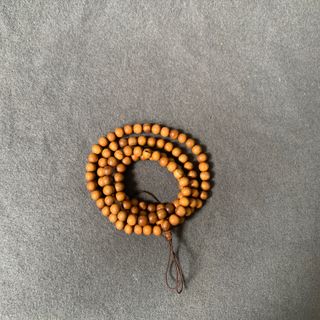 Vòng gỗ bách xanh đồng giá