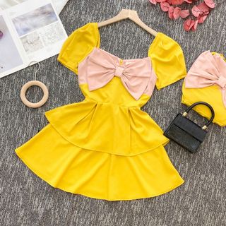 Đầm Vàng Trắng Tầng Nơ Ngực