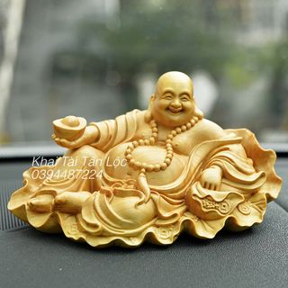 Tượng Phật Di Lặc ngồi lá sen cầm thỏi vàng gỗ hoàng dương cao 7 cm giá sỉ