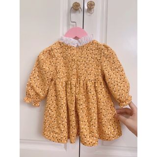 Váy bé gái hoa nhí vàng thiết kế