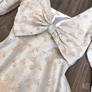 Đầm gấm xòe nơ sau