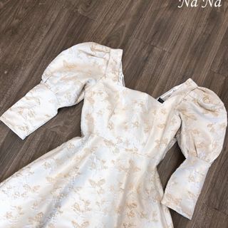 Đầm gấm xòe nơ sau