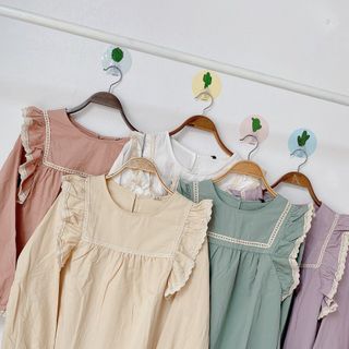 Áo kiểu tay dài tua vai