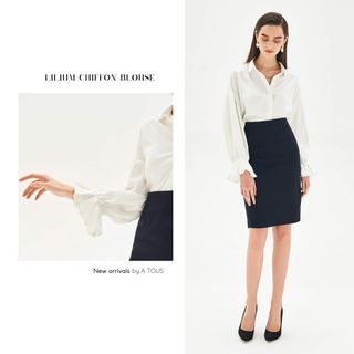 Chân váy bút chì đen trên gối xẻ sau