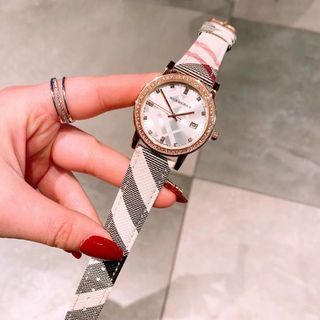 Đồng hồ nữ dây da mặt tròn viền hột Bur,bery