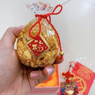 Túi tiền và đĩnh vàng ban thần tài