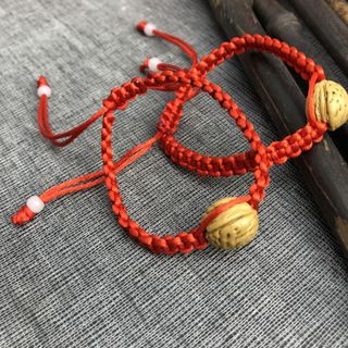 Vòng tay dây rút hạt gỗ