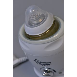 Máy làm nóng bình sữa và túi trữ sữa ( chính hãng )Tommee Tippee TTEXPRESSANDGO82032
