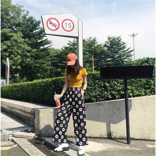 Quần dài in bông cúc chất da cá