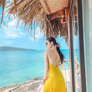 Đầm váy maxi vàng đi biển nút eo xẻ ta