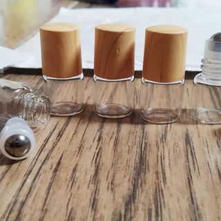 sỉ số lượng vỏ chai 1ml bi lăn thép nấp vân gỗ đựng tinh dầu chống rà dịch ra ngoài mẫu cao cấp giá sỉ