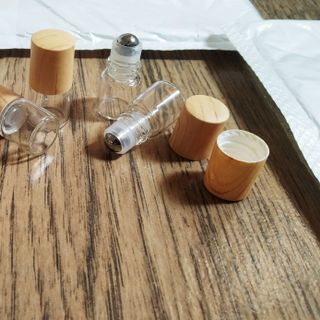 sỉ số lượng vỏ chai 1ml bi lăn thép nấp vân gỗ đựng tinh dầu chống rà dịch ra ngoài mẫu cao cấp
