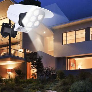 Đèn led giả CAMERA năng lượng mặt trời cảm biến tự động bật tắt chống trộm kèm điều khiển 100W siêu sáng giá sỉ