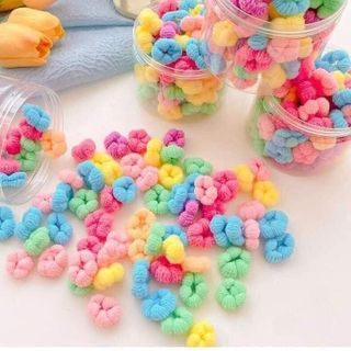 Hộp 100 dât cột tóc trơn hình bông cho bé nhiều màu tiện lợi Sweet Baby giá sỉ