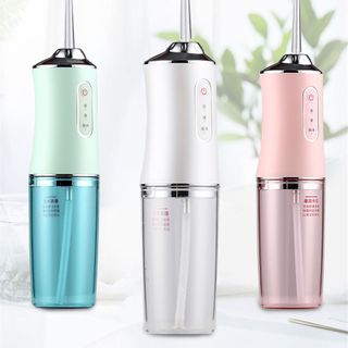 Máy tăm nước Chăm Sóc Răng Miệng Gồm 4 Đầu Thay Thế - Giá Sỉ
