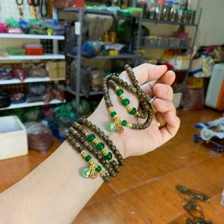 Vòng trầm hương mix điếu đồng tiền tài lộc