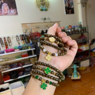 Vòng trầm hương mix điếu đồng tiền tài lộc