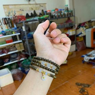Vòng trầm hương mix điếu đồng tiền tài lộc