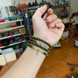 Vòng trầm hương mix điếu đồng tiền tài lộc