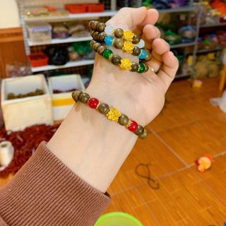Vòng trầm hương mix hoa sen vàng