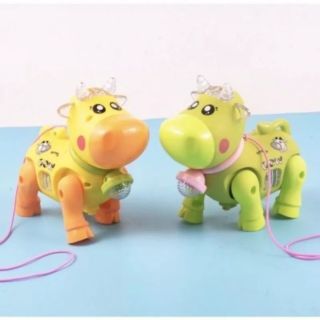 Đồ chơi trẻ em con bò chạy pin phát nhạc và có đèn led lấp lánh