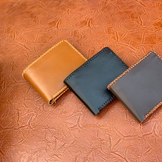 Ví khâu viền chân kim da bò
